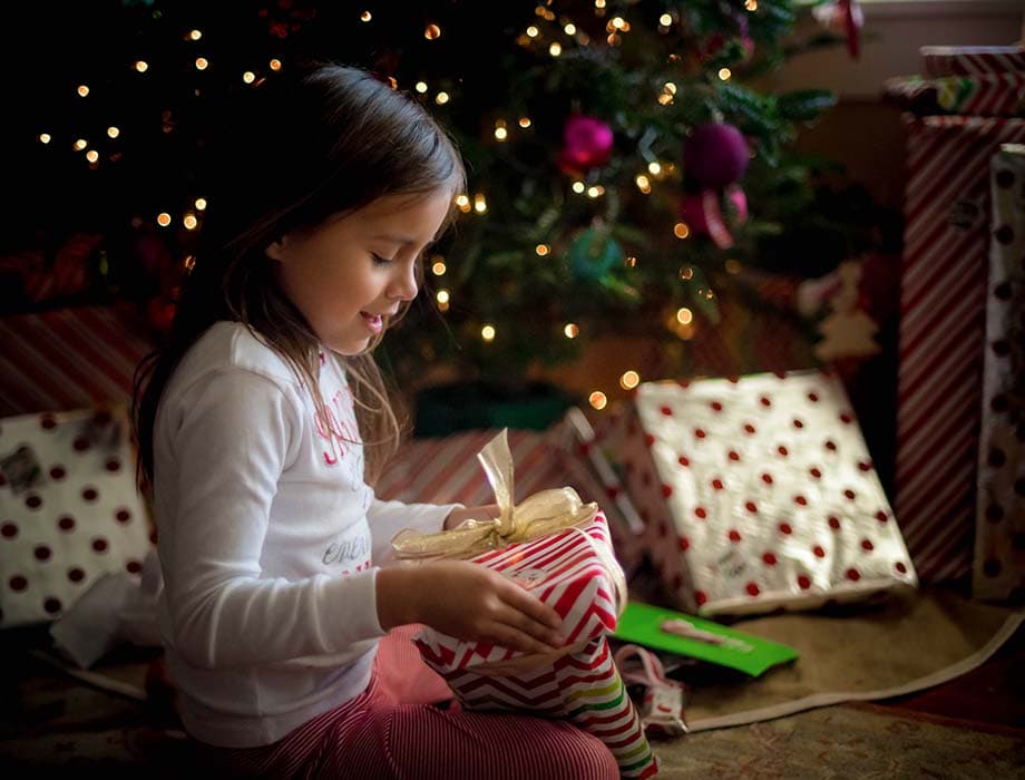 image of girl viewing present from Santa